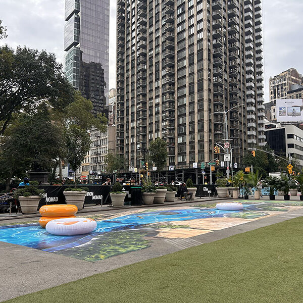 Disney Lakeshore Lodge – Site View Site set-up view of Disney Lakeshore Lodge 3D anamorphic street painting at Flatiron Plaza in Manhattan, New York City.